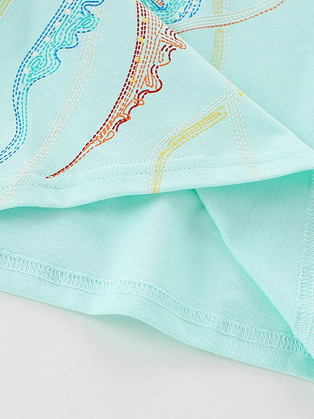 Toddler tee in light blue cotton with colorful embroidered jellyfish graphic detail.