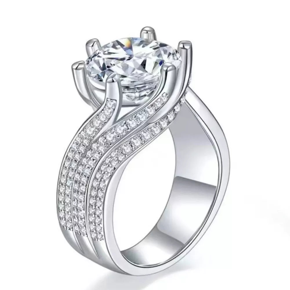 Exquisite Moissanite solitaire ring in silver with pave diamond band.