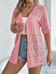 Pink open-knit pointelle cardigan with short sleeves and V-neck.