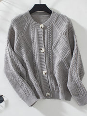 Gray cable-knit button-down cardigan with diamond and braid textures.
