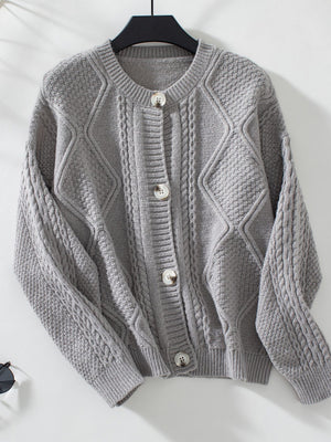 Gray cable-knit button-down cardigan with diamond and braid textures.