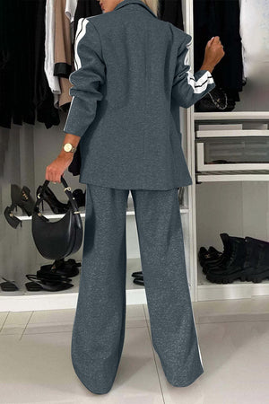 Track stripe blazer and wide leg trouser set in gray with white side stripes.
