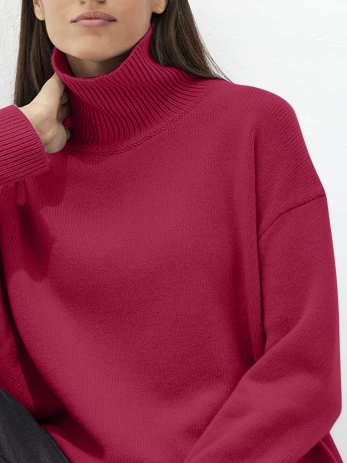 Cerise ribbed turtleneck knit sweater with relaxed fit and acrylic material.