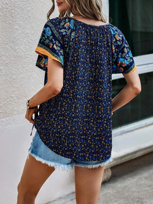 Dark blue bohemian floral print flutter sleeve blouse with yellow trim