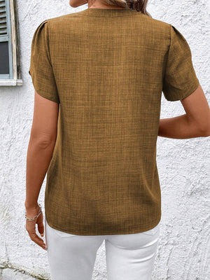Camel textured blouse with short puff sleeves and a keyhole neckline.
