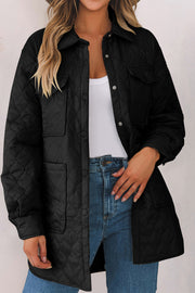 Black quilted utility jacket with chest pockets and snap buttons.