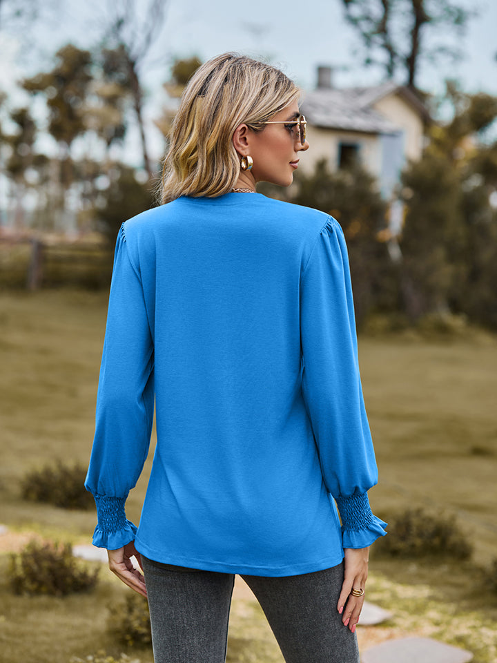 Sky blue blouse with pleated yoke and shirred cuffs
