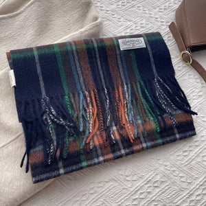 Classic wool plaid scarf with tassels in navy, green, orange, and white.