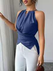 Denim blue polyester tank top with gathered neck, crisscross wrap, and beaded detail.