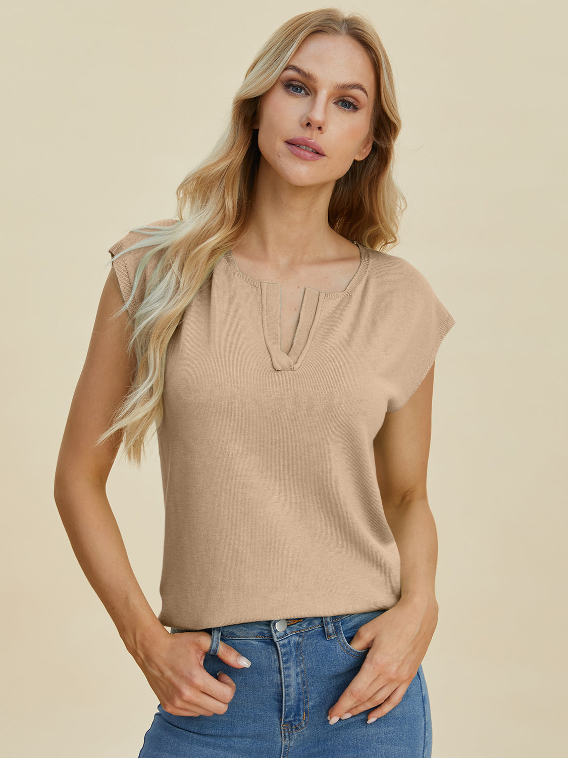 Keyhole neckline knit tee in caramel acrylic with cap sleeves.