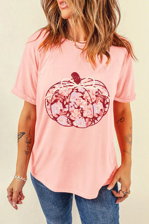 Blush pink t-shirt with a floral pumpkin graphic and a bow detail.