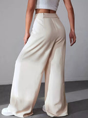 Apricot high-waisted pleated wide-leg maternity trousers with a button-down closure.