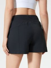 Coastal drawstring utility shorts in black with elastic waistband and side pockets.
