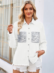 White denim shirt with sequin pocket details and frayed hem.