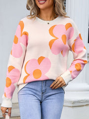 Oversized knit sweater in ivory with pink and orange floral print, crew neck, long sleeves.