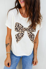White cotton crew neck t-shirt with a large leopard print bow graphic.