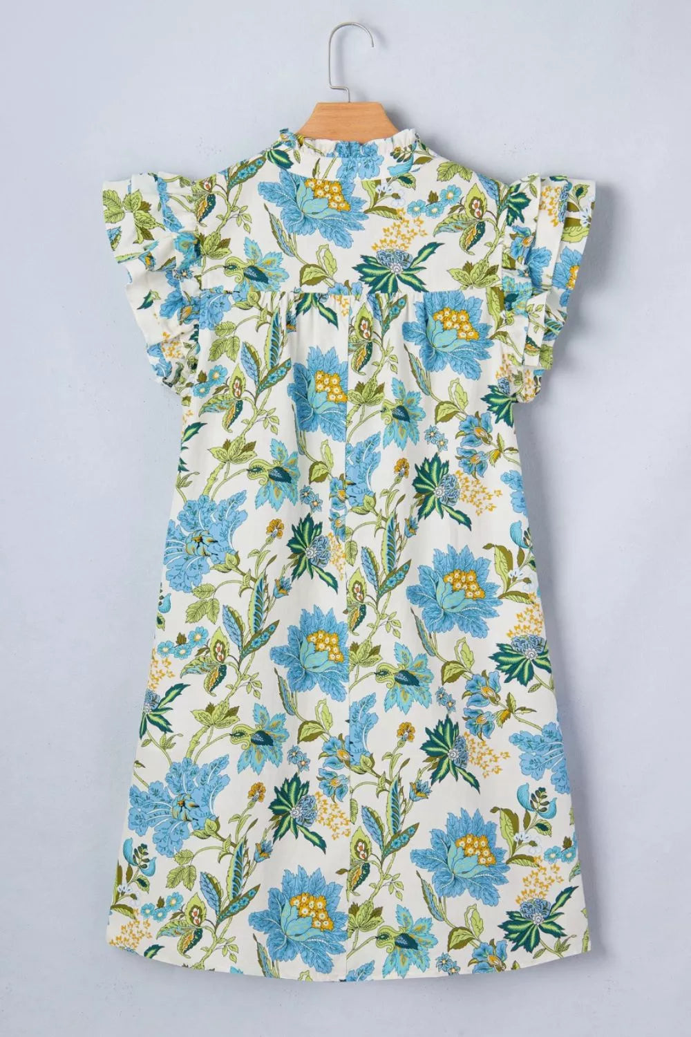 Cotton floral mini dress with ruffled sleeves and a high neckline.