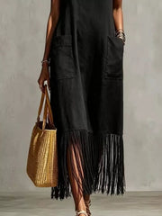 Black maxi dress with pockets and fringe hem, V-neck, sleeveless, casual style.