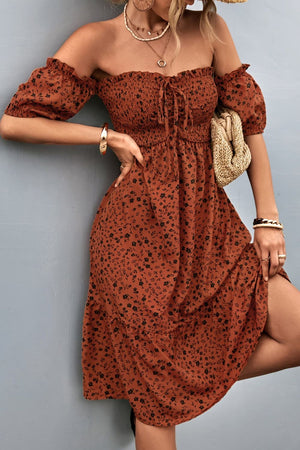 Brown floral smocked bodice midi dress with bubble sleeves and tie detail