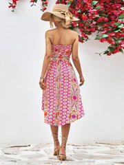 Printed bandeau midi dress with asymmetric hem and belt in hot pink.
