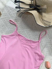 Pink cami top with scoop neck and spaghetti straps