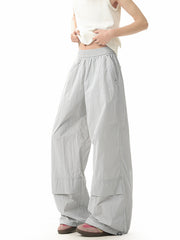 Men's light gray lightweight cargo pants with elastic waist and flap pockets.