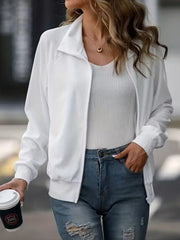 White ribbed zip-up track jacket with raglan sleeves and a stand-up collar.