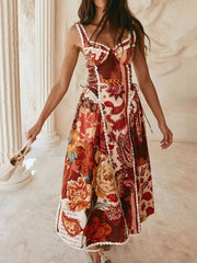 Midi dress with paisley floral print, lace trim, sweetheart neckline, and tie sides.