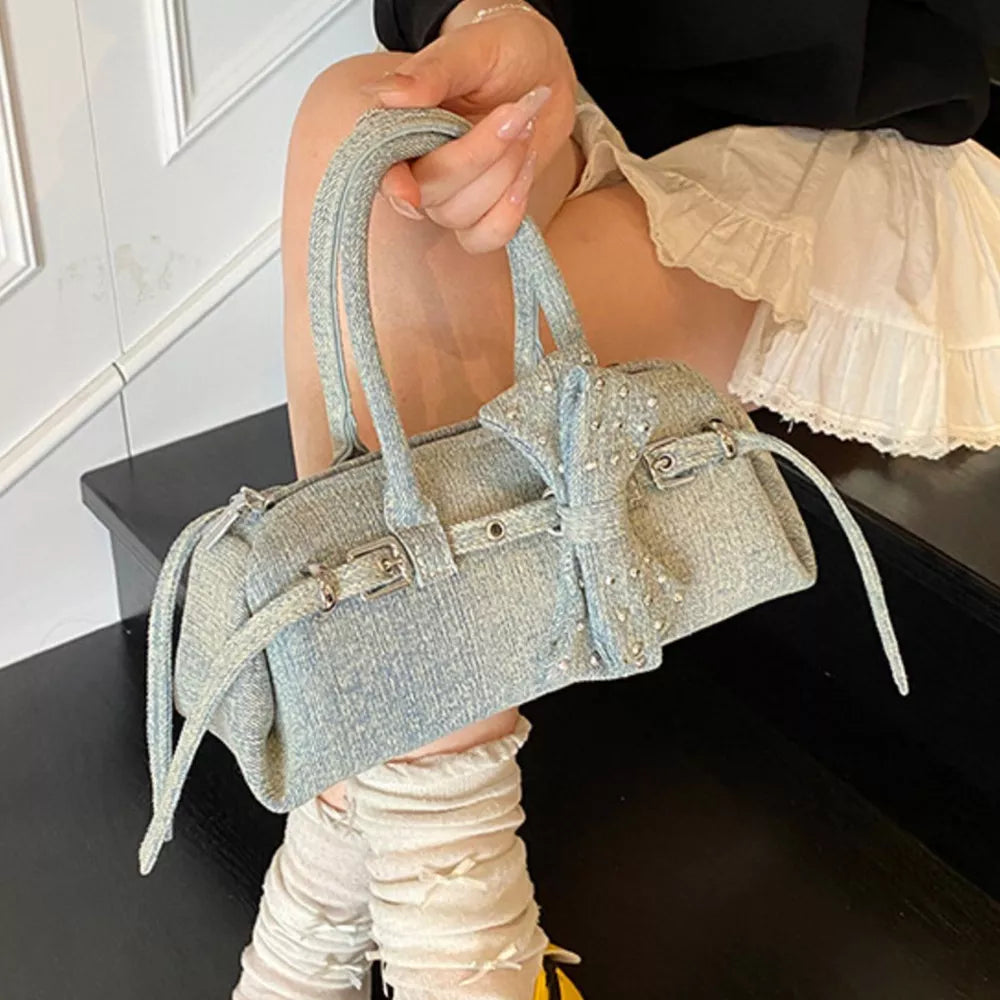 Denim Bow Accent Crossbody Bag in Blue, model styling view