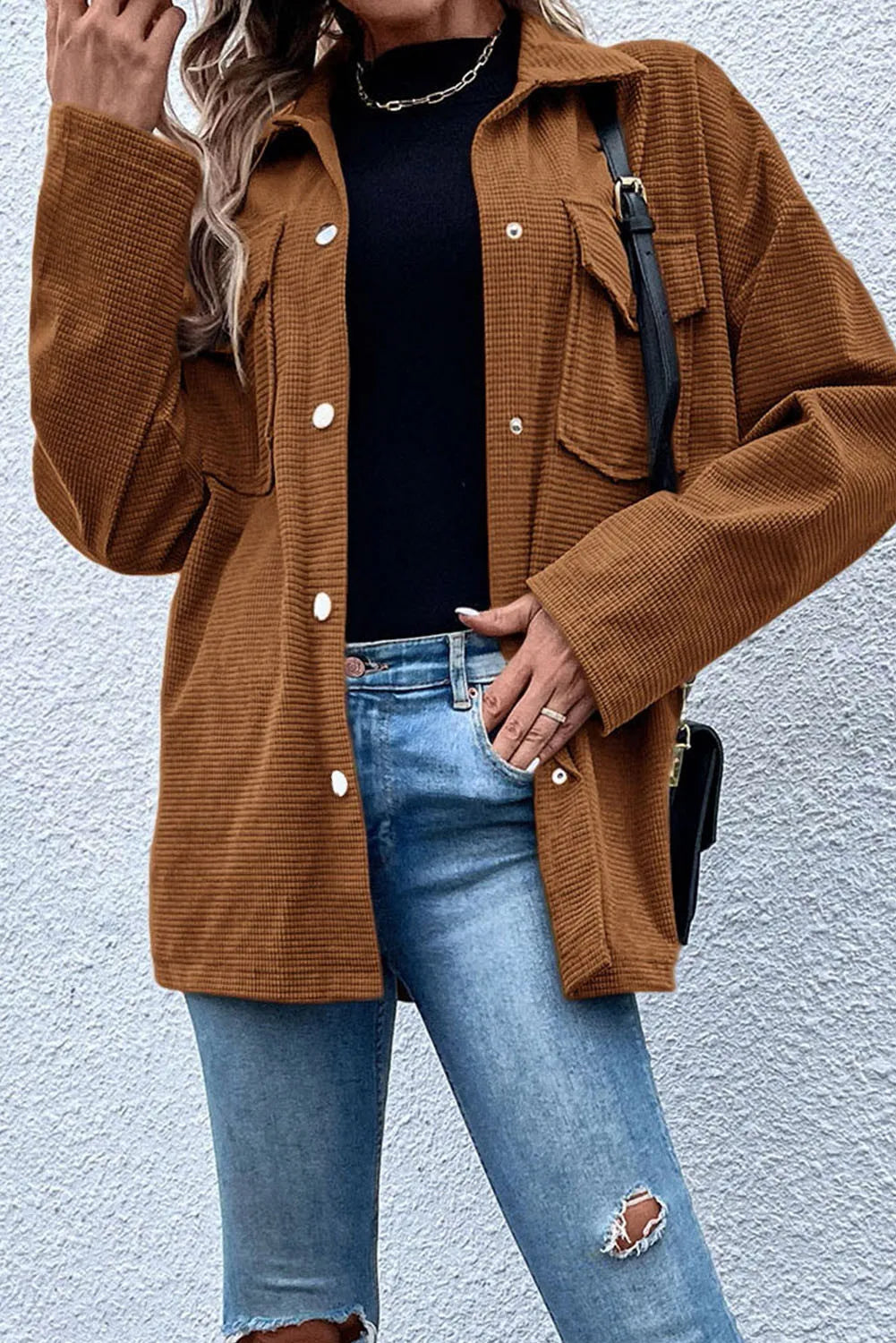 Brown waffle knit overshirt with patch pockets and button-down front.
