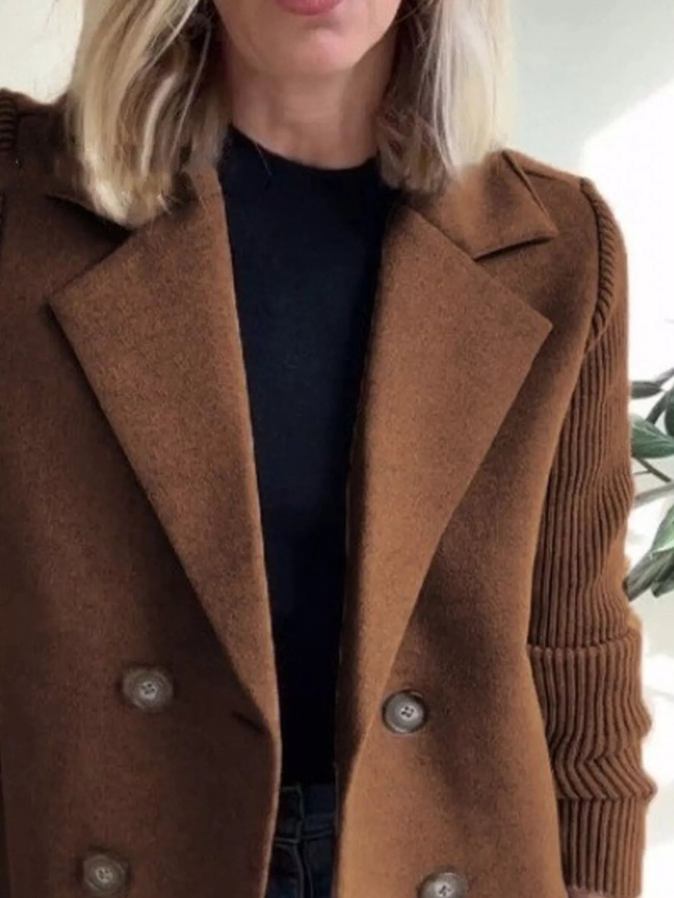 Brown double-breasted wool blend blazer with button detail and textured sleeves.