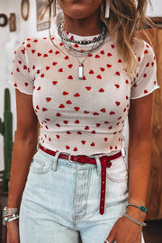 White sheer mesh t-shirt with red hearts, short sleeves, and lettuce hem.