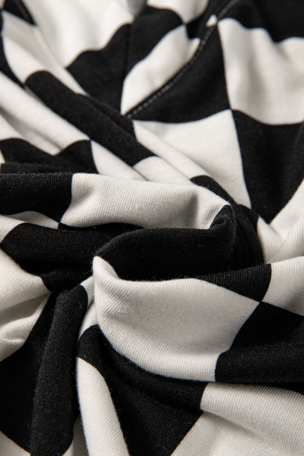 Black and white checkered outfit set fabric detail