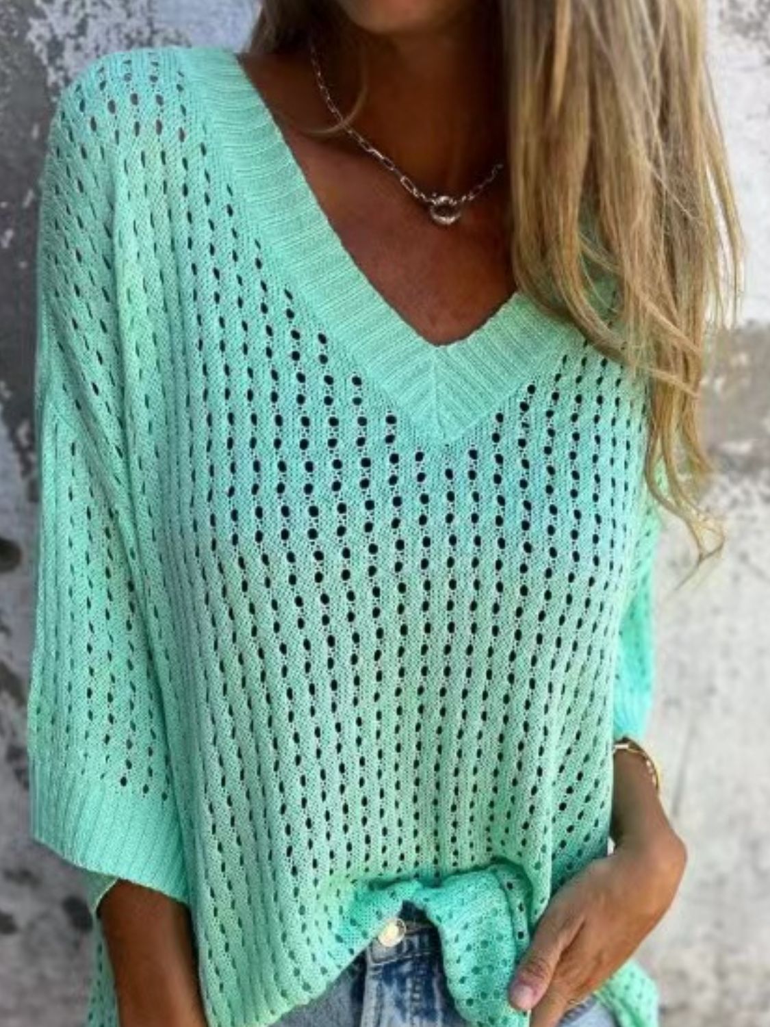 Open-knit V-neck sweater in Tiffany Blue with a slouchy fit.