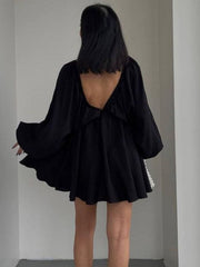 Black ruched V-neck dress with balloon sleeves and a low back