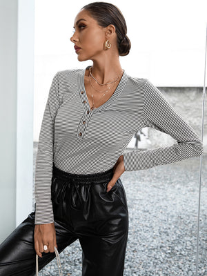 Ribbed Henley stripe top in gray with button detail and long sleeves.