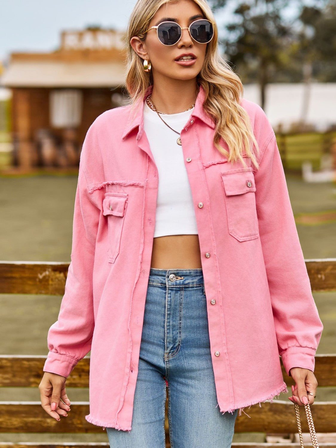 Frayed edge overshirt in carnation pink with patch pockets and button front.