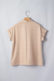 Beige crochet lace pullover with rolled sleeves and mock neck.
