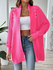 Pearl button ribbed knit cardigan in bright pink with a relaxed fit and open front.