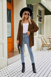 Chestnut open front cardigan with pockets and textured sleeves.