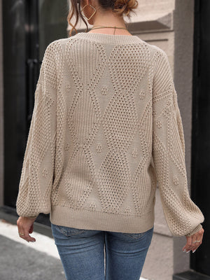Camel diamond lattice knit sweater with balloon sleeves and open knit details.