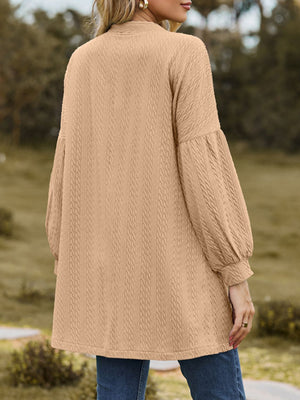 Taupe textured open cardigan with balloon sleeves and a cable knit pattern.