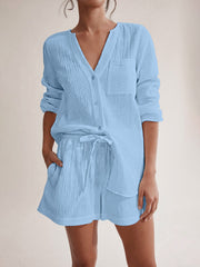 Light blue textured cotton pajama set with button-up shirt and drawstring shorts