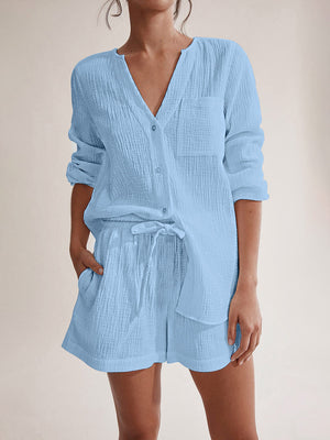 Light blue textured cotton pajama set with button-up shirt and drawstring shorts