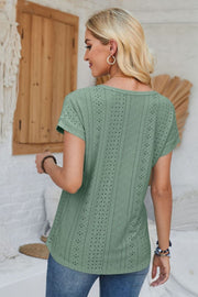 Sage green perforated eyelet tee with cuffed short sleeves and a relaxed fit.