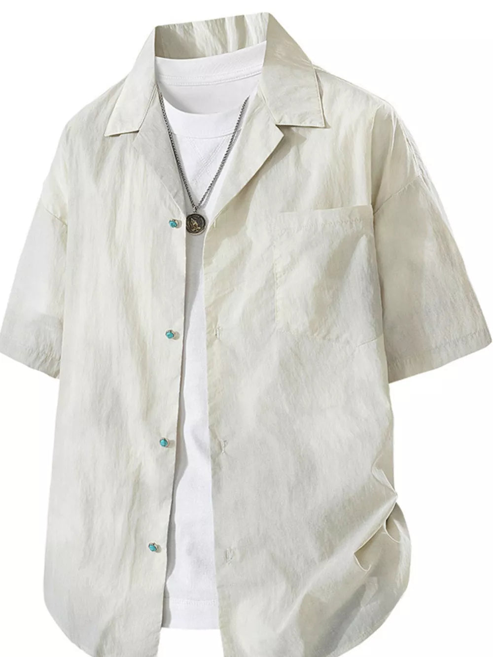 Relaxed fit camp collar shirt in apricot, buttoned, with a chest pocket and turquoise button details.