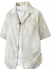 Relaxed fit camp collar shirt in apricot, buttoned, with a chest pocket and turquoise button details.