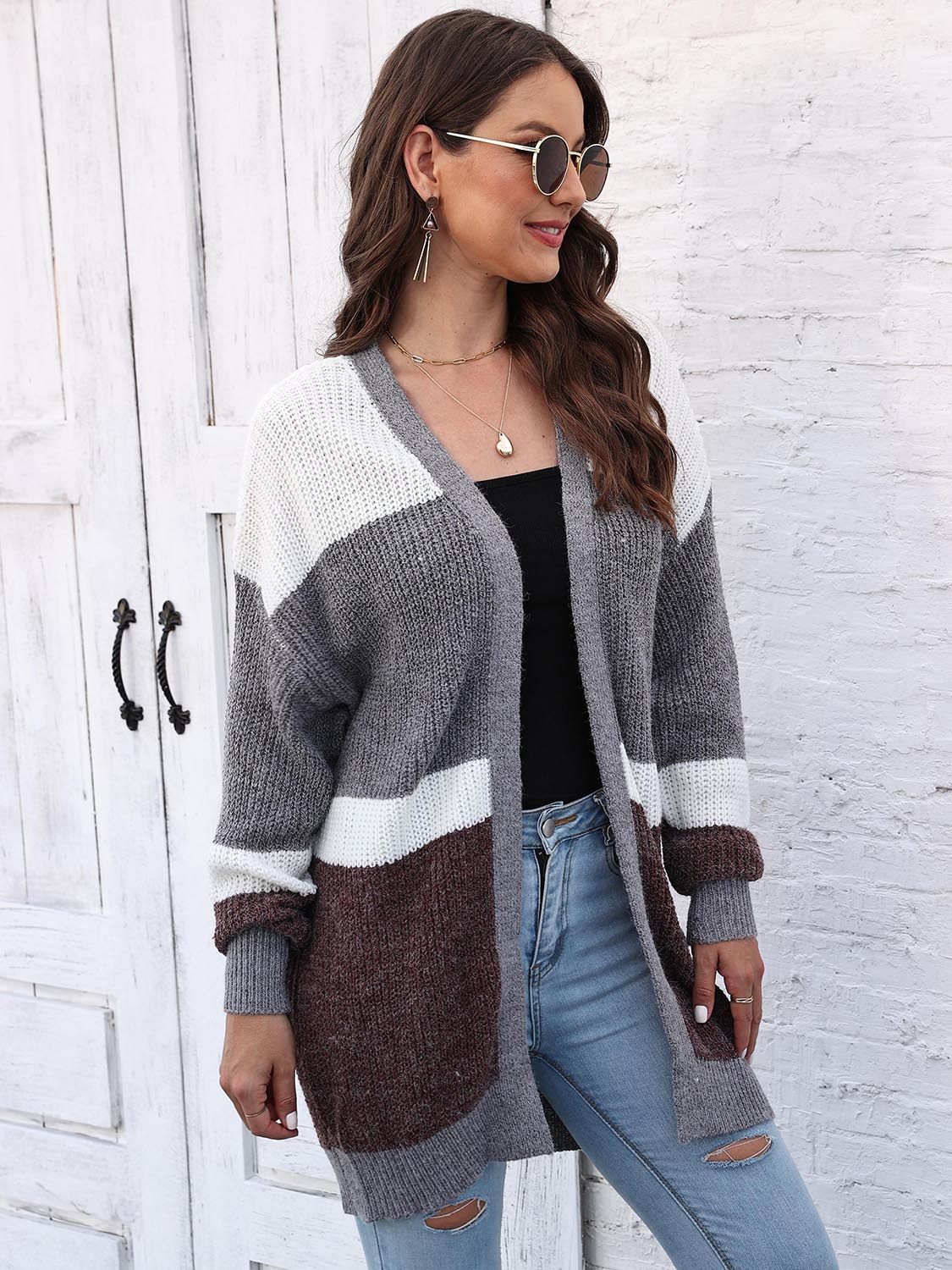 Colorblock knit open cardigan in dark gray, white, and brown with a relaxed fit.