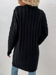 Black cable knit button-down cardigan with ribbed texture and cable sleeves.