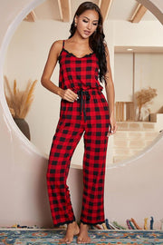 Red plaid cami jumpsuit with black lace trim and drawstring waist.